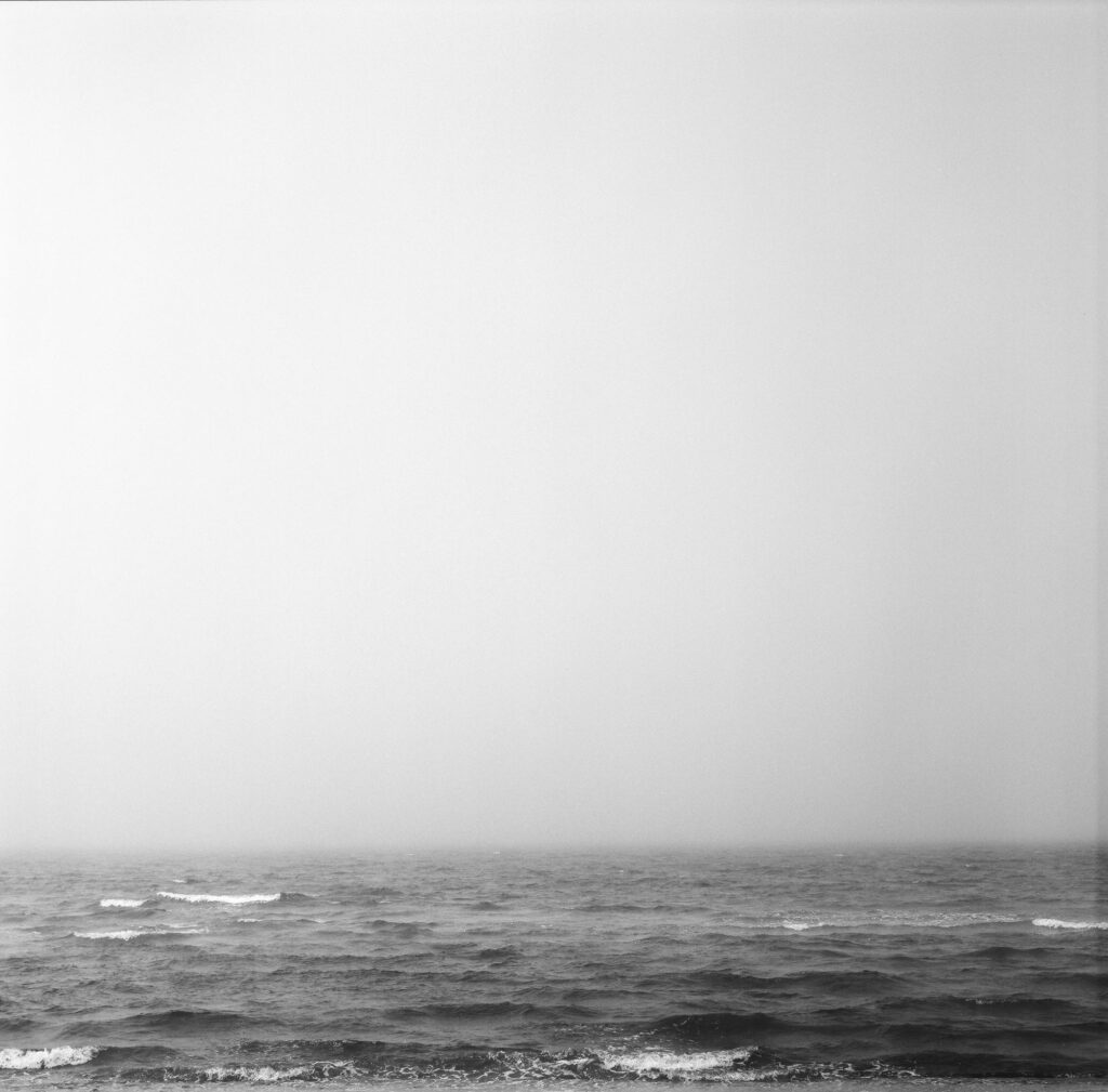 Black and white image of waves at Chapoquoit Beach