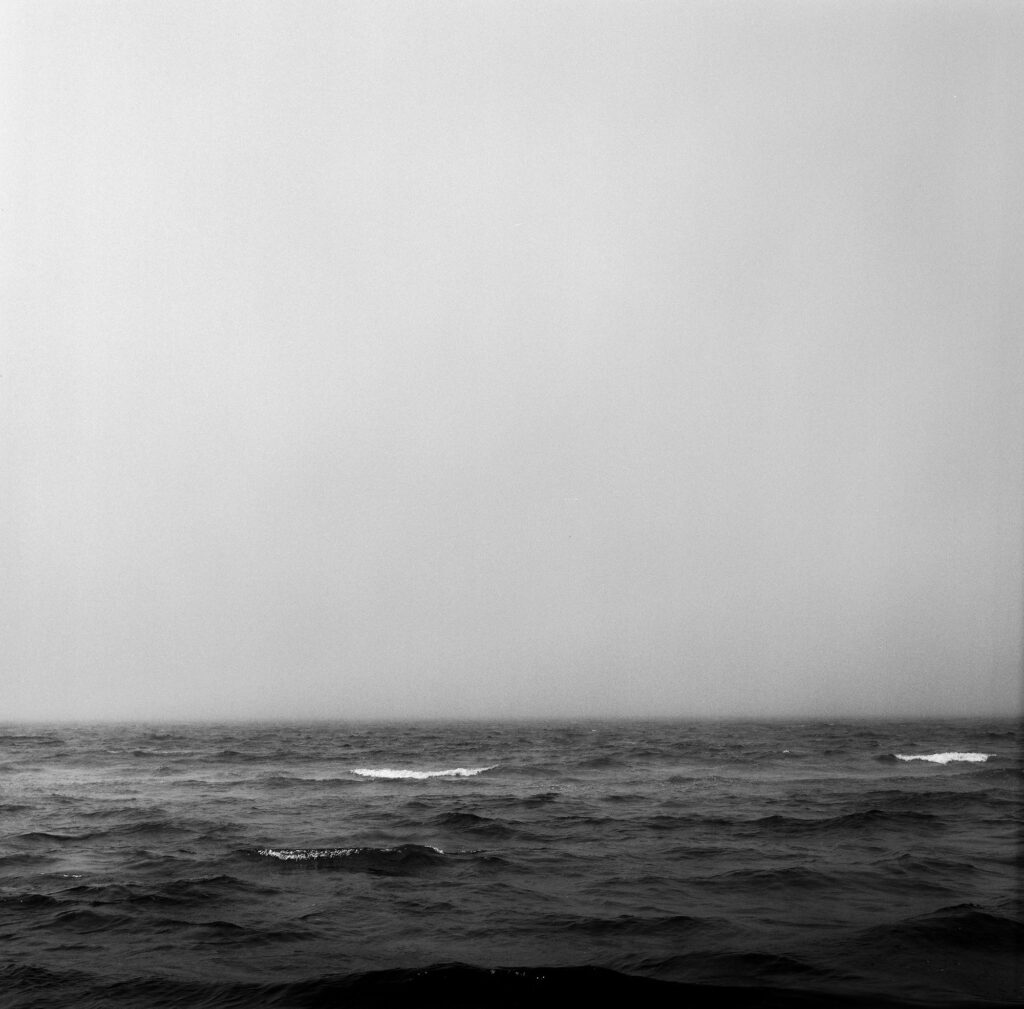 Black and white image of waves at Chapoquoit Beach